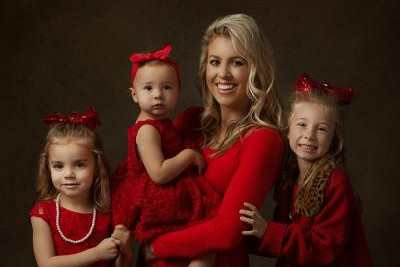 Mother with daughters dressed in red
