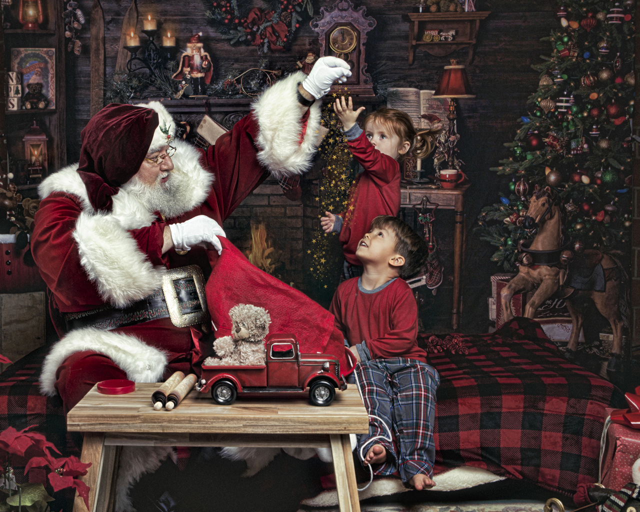 Santa dropping fairy dust during a Christmas mini photoshoot
