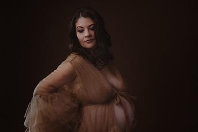 Expectant mother in gown with frills