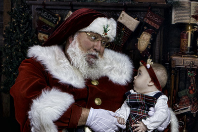 Santa looking at a babyS
