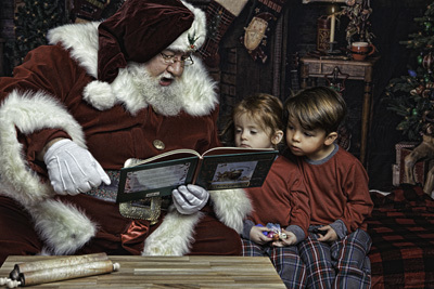 Santa reading to young kids