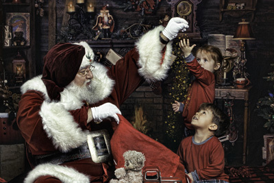 Santa sprinkling Christmas stars on young kids